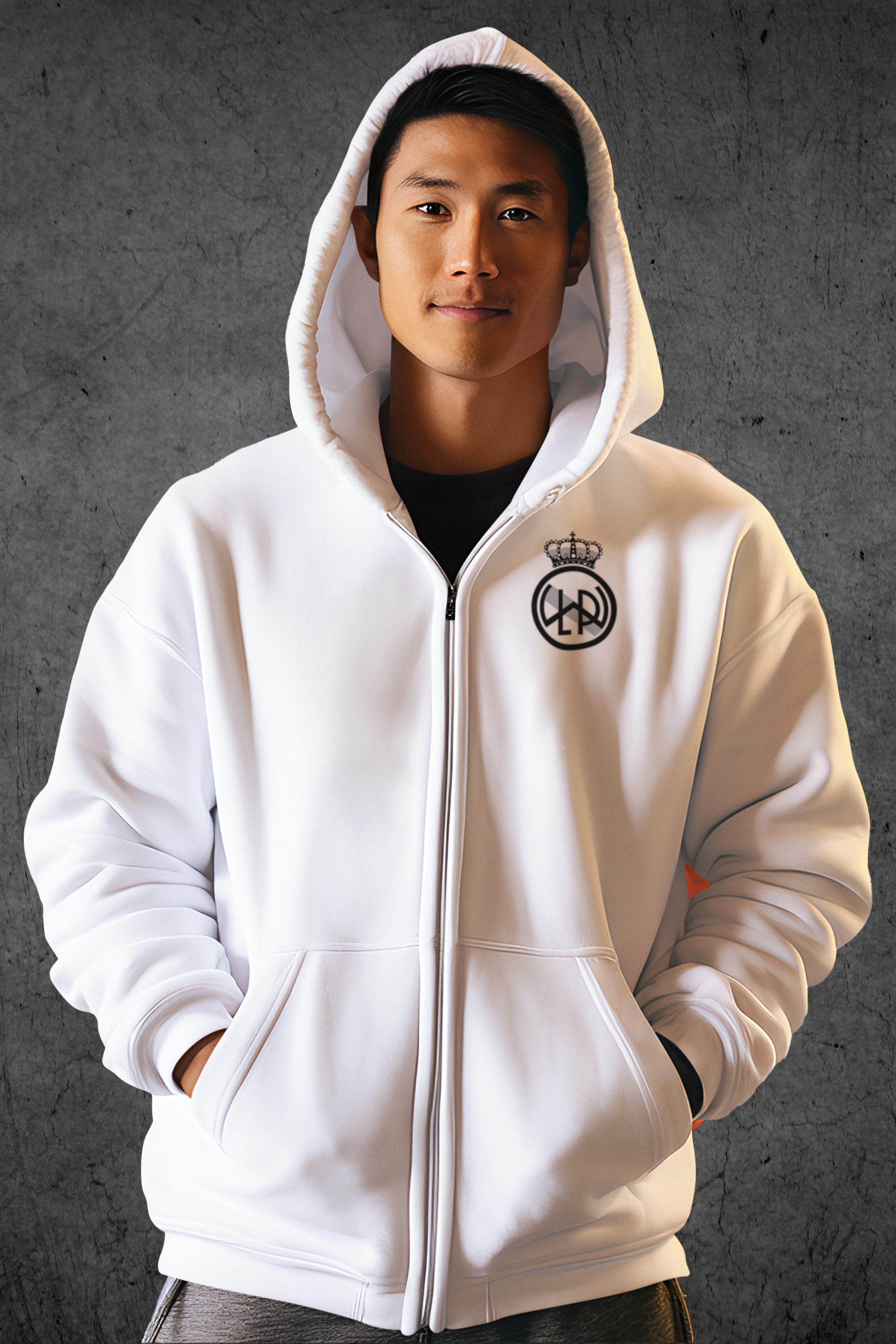 A young asian man wearing a white zip-up hoodie with a Lake Washington Premier FC club creat in black and white on the left breast.