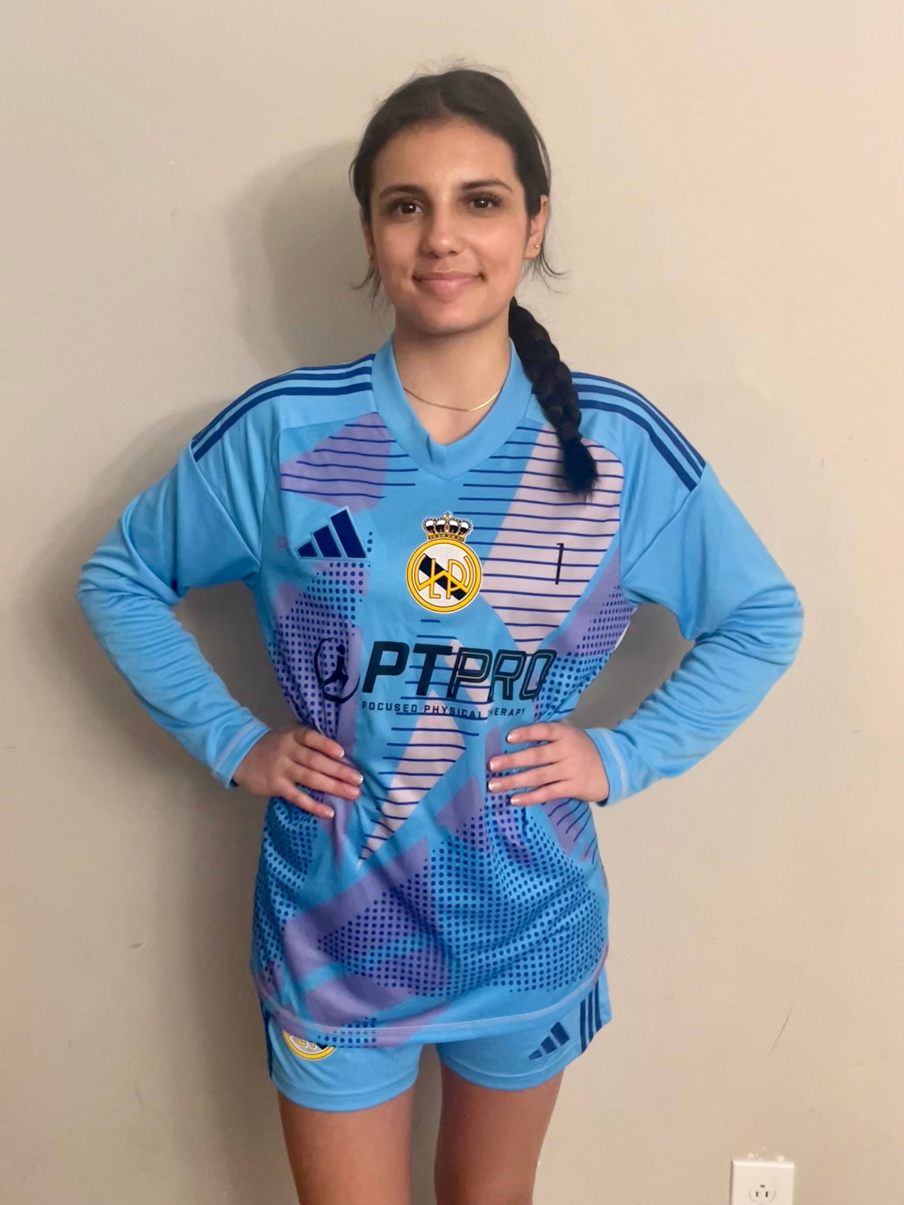 A picture of a female soccer player wearing a blue LWPFC Goalkeeper uniform 
